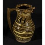 An antique Staffordshire agate ware puzzle jug .8 and half inches.