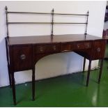 A Regency mahogany sideboard with brass gallery to the back, left hand drawer fitted for wine