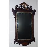 A Regency walnut wall mirror .3 ft by1. Ft 8 inch.