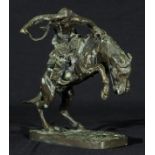 A bronze figure group of a horse and cowboy, after Remington