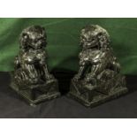 A pair of granite serpentine temple dogs, 30cm tall