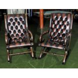A pair of leather upholstered rocking chairs, approx 30 years old hand made.