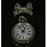 A lady's silver pocket watch with enameled dial together with a silver bow brooch