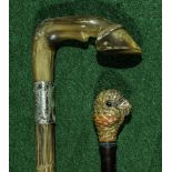 Two walking canes one with bone handle carved as a horses hoof together with a parakeet handle