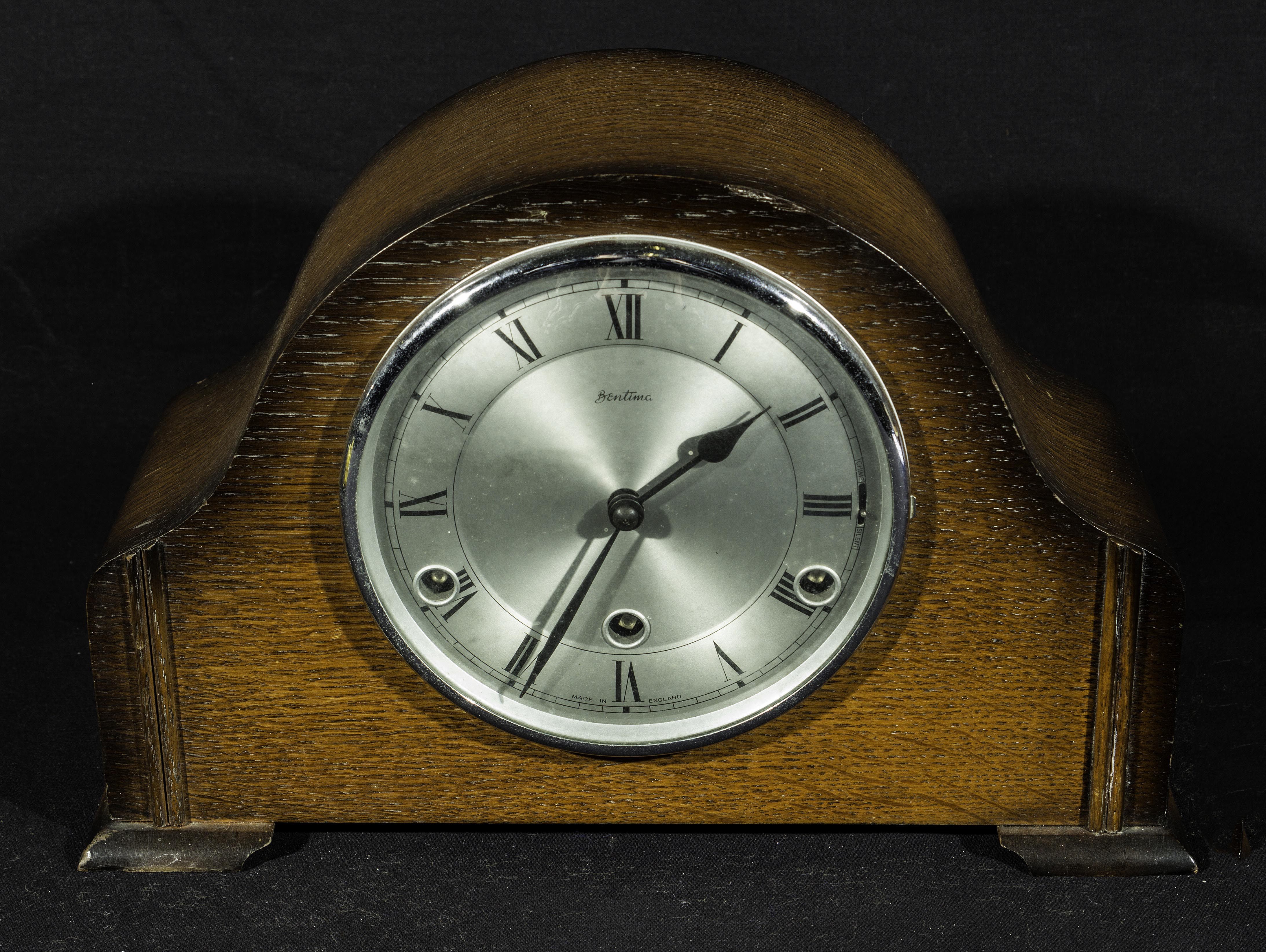 An oak mantle clock