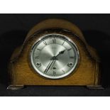 An oak mantle clock