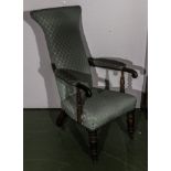 A Victorian high backed rosewood framed upholstered armchair