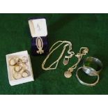 A collection of silver rings, earrings, two lockets and chains, two bracelets and a book mark