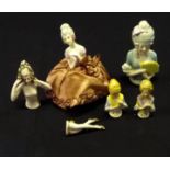 Five porcelain pin cushion dolls