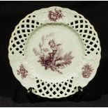 A Minton porcelain plate with a cherub and foliage, 24cm in diameter