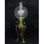 An Arts and Crafts brass oil lamp