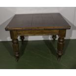 A Victorian draw leaf kitchen table.