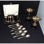 Five silver coffee spoons, nine silver teaspoons and two small silver trophies