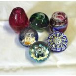 Six glass paperweights