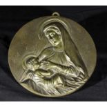 A bronze plaque signed B Neidzwiecki of Madonna and child