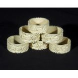 Six carved ivory napkin rings