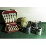 A canteen of fish cutlery, plated three piece tea service and a glass lamp shade