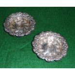 A pair of small embossed silver dishes