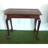 An early 19th mahogany side table with draw,on ball and claws legs.