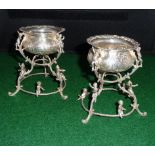 A pair of Dutch silver salts on filigree and cherub bases