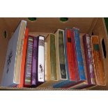 A box of Folio Society books including Sagitarius Rising, Best After Dinner Stories and The First