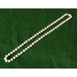 A single string of pearls with silver stone set clasp