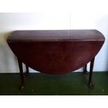 A Georgian mahogany drop leaf pad foot table.