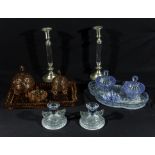 Two glass dressing table sets and a pair of candlesticks