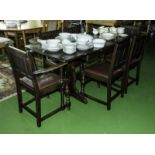 A draw leaf table and six chairs