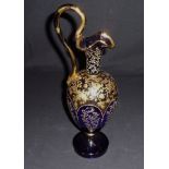 A Bohemian style blue ground glass ewer with gold decoration