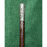 A silver topped swagger stick