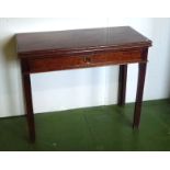 A Georgian mahogany turn over top tea table.