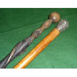 A Celtic walking and a silver topped malaca cane