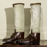 A pair of canvas and leather riding boots