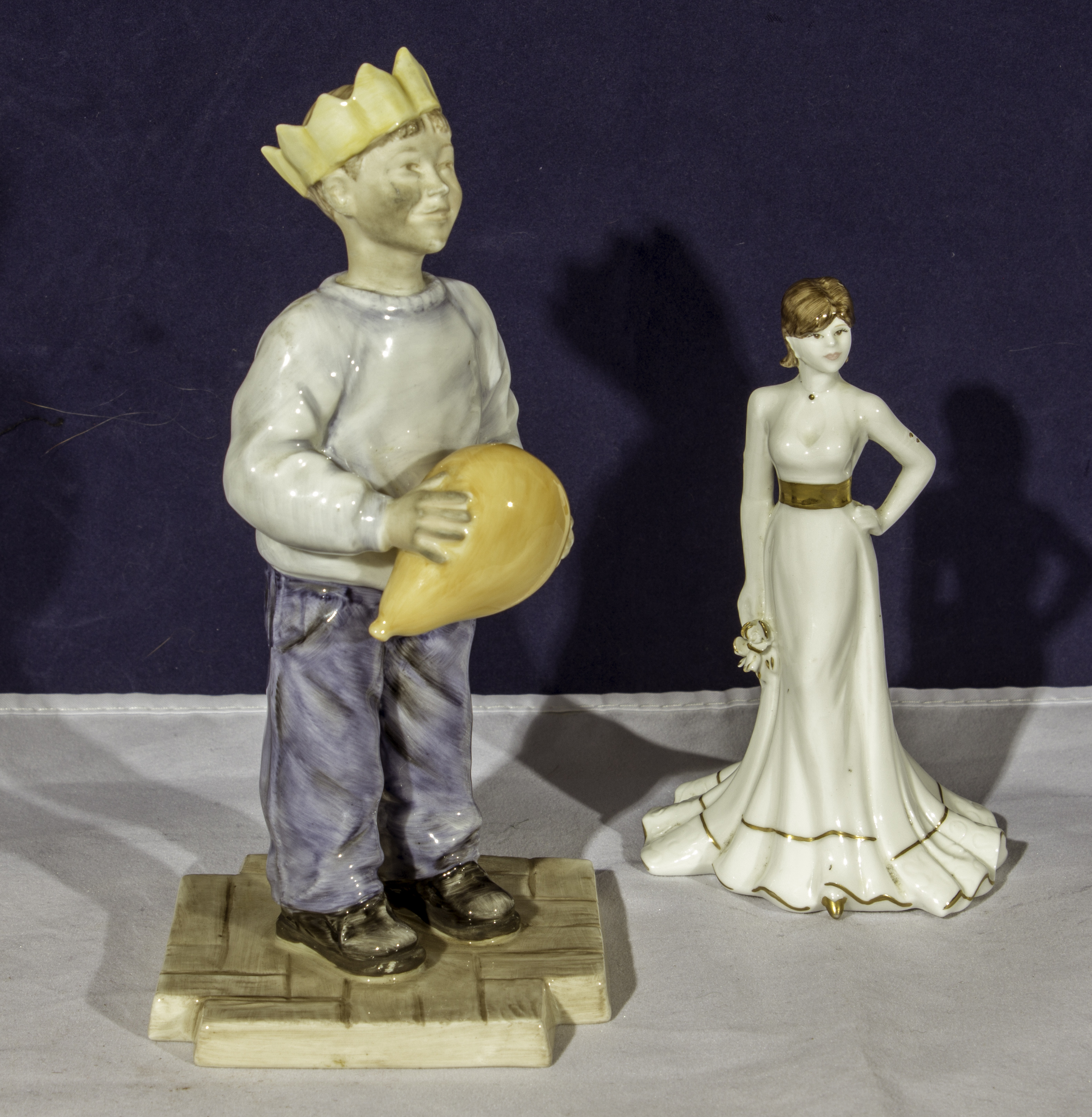 Porcelain figure of a boy with balloon together with a Coalport figure Tiffany