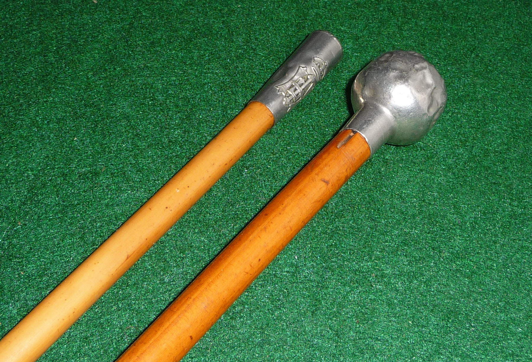 Two silver topped swagger sticks
