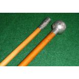 Two silver topped swagger sticks