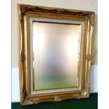 A gilt framed mirror