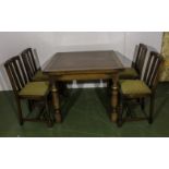 An oak draw leaf table 4 chairs