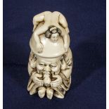 A Japanese carved ivory erotic netsuke