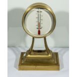 A bronze cased thermometer