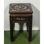 A Chinese padouk wood stand inlaid with mother of pearl