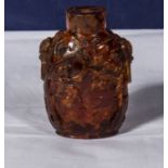 A Chinese amber snuff bottle of large size