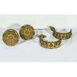 Two large pairs of embossed gilt curtain tie backs