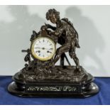 A bronze clock on marble base