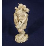 A Chinese carved ivory figure