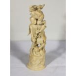 A Japanese carved ivory figure of a man with club and two demons, 29cm tall