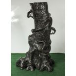 Large bronze vase of a tree stump encircled by a snake