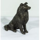 A cold cast resin bronze of a sitting collie dog