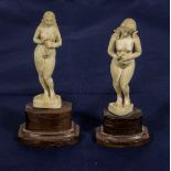 Two carved ivory nudes on wooden bases